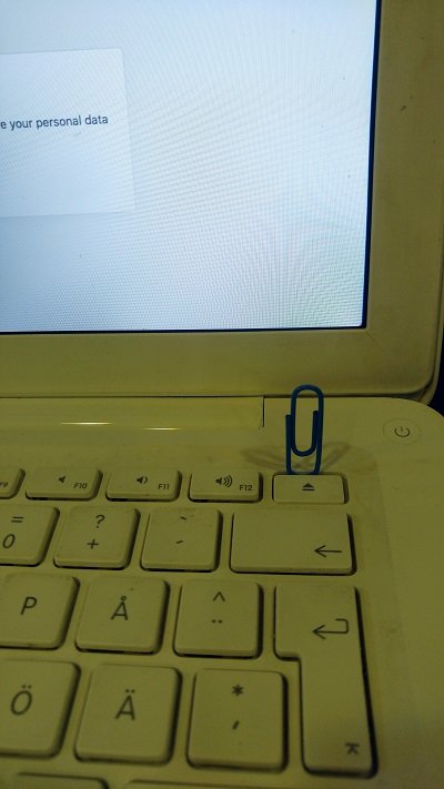 Paper clip to keep eject button pressed